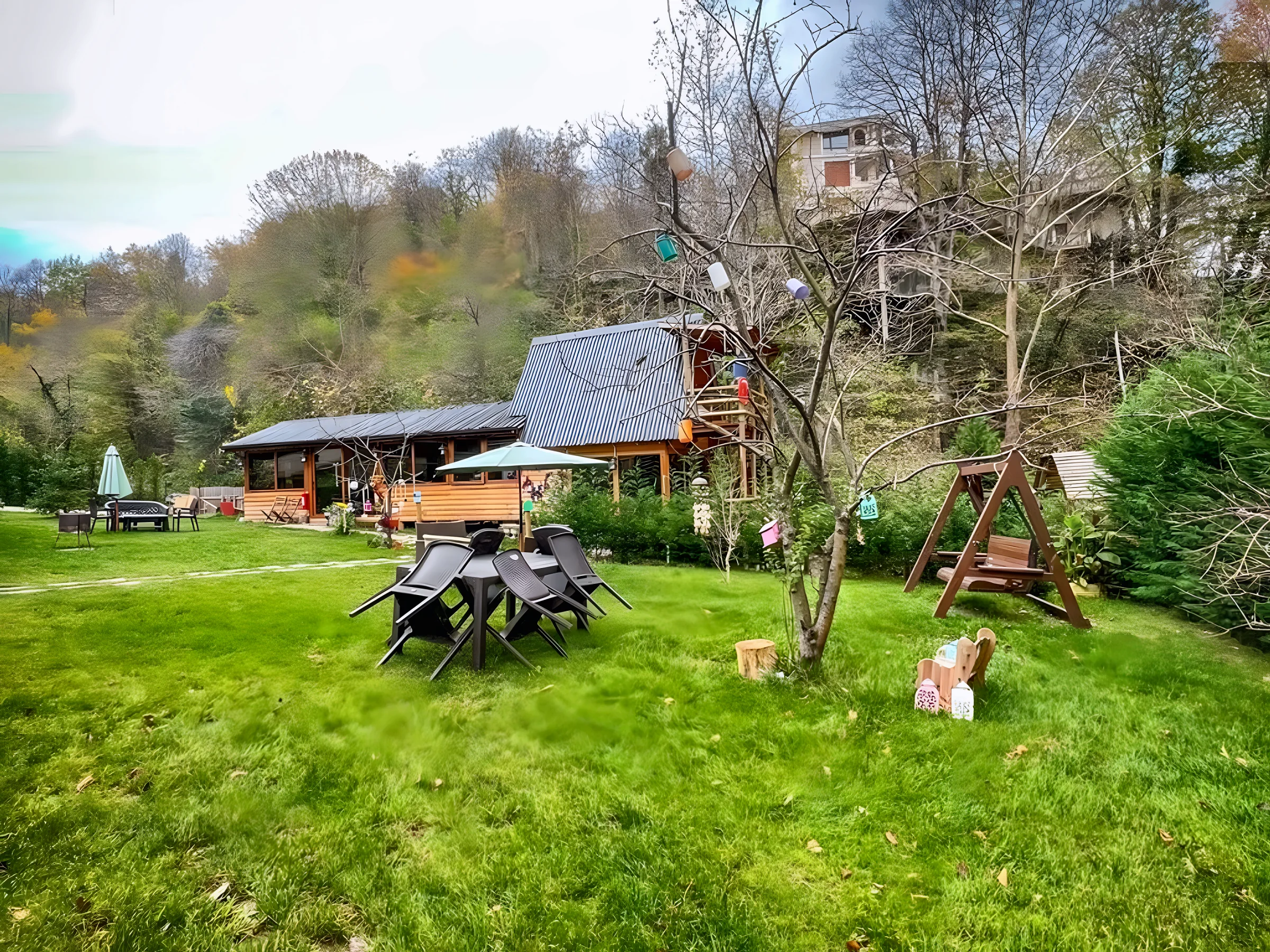 The tree-lined garden at Natural Life, ready for a long celebration table
